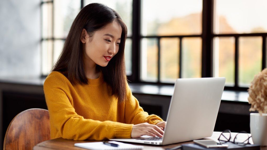 Business owner checking search rankings on laptop